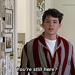 Ferris Bueller GIF wearing robe asks "You're still here?" from movie scene inside suburban home